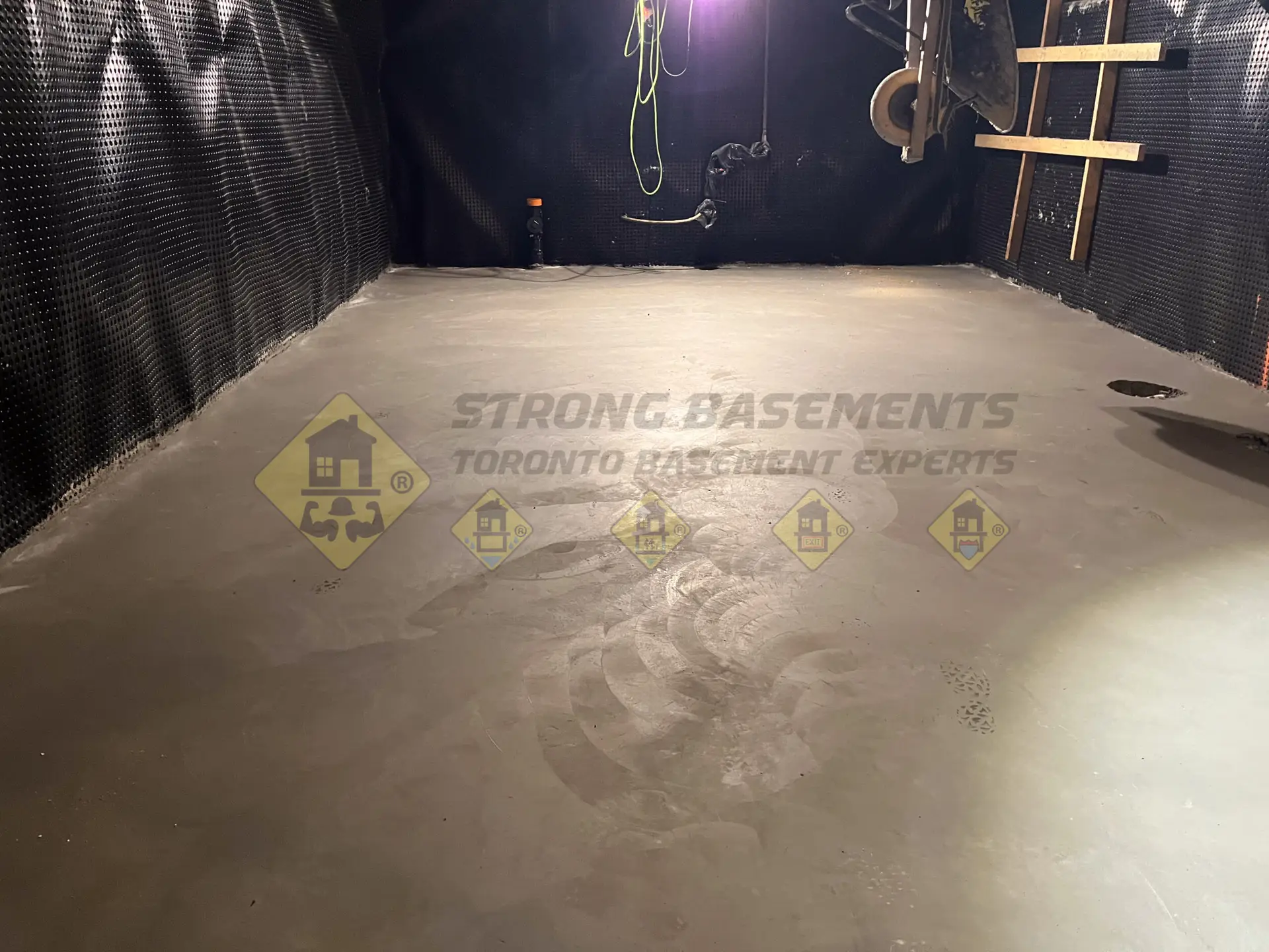 A fully cured, perfectly level, and dry concrete slab floor in a newly lowered Leaside, Toronto basement, ready for the finishing renovation team.